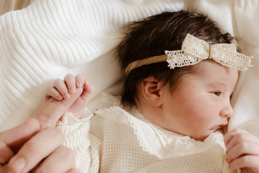 a woman holding a baby in her arms