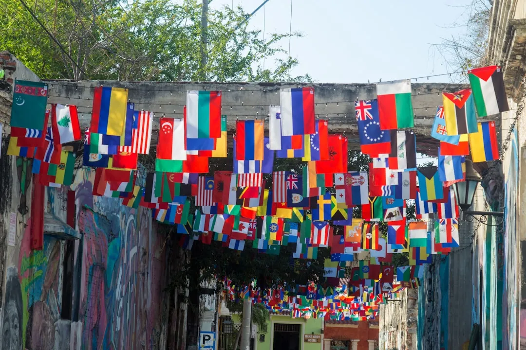 a wall with a bunch of flags
