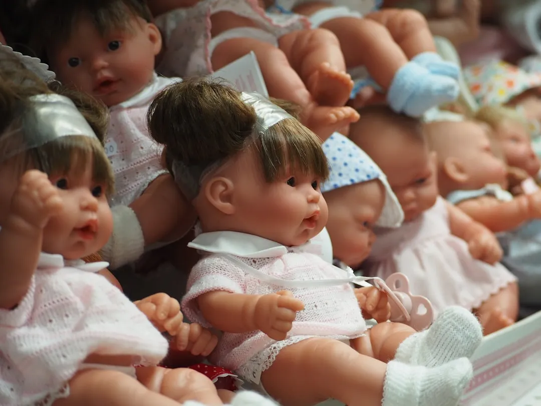 a group of baby dolls sitting next to each other