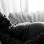 pregnant woman lying on the sofa