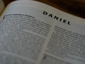 a close up of an open book with the word daniel on it