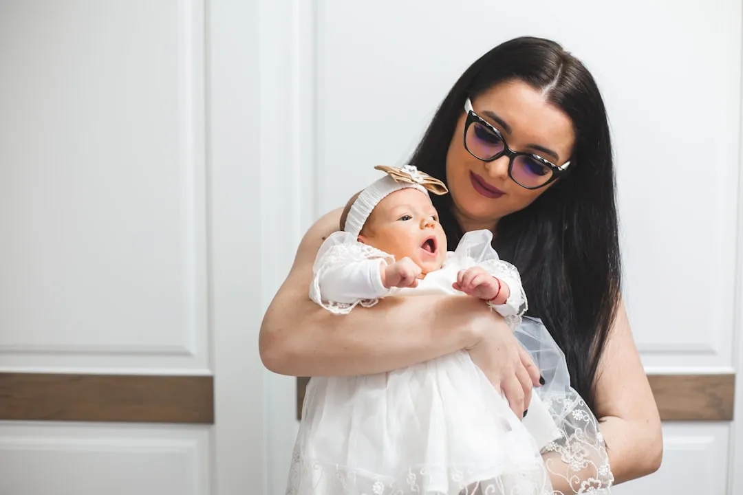 Mother holding her newborn baby girl