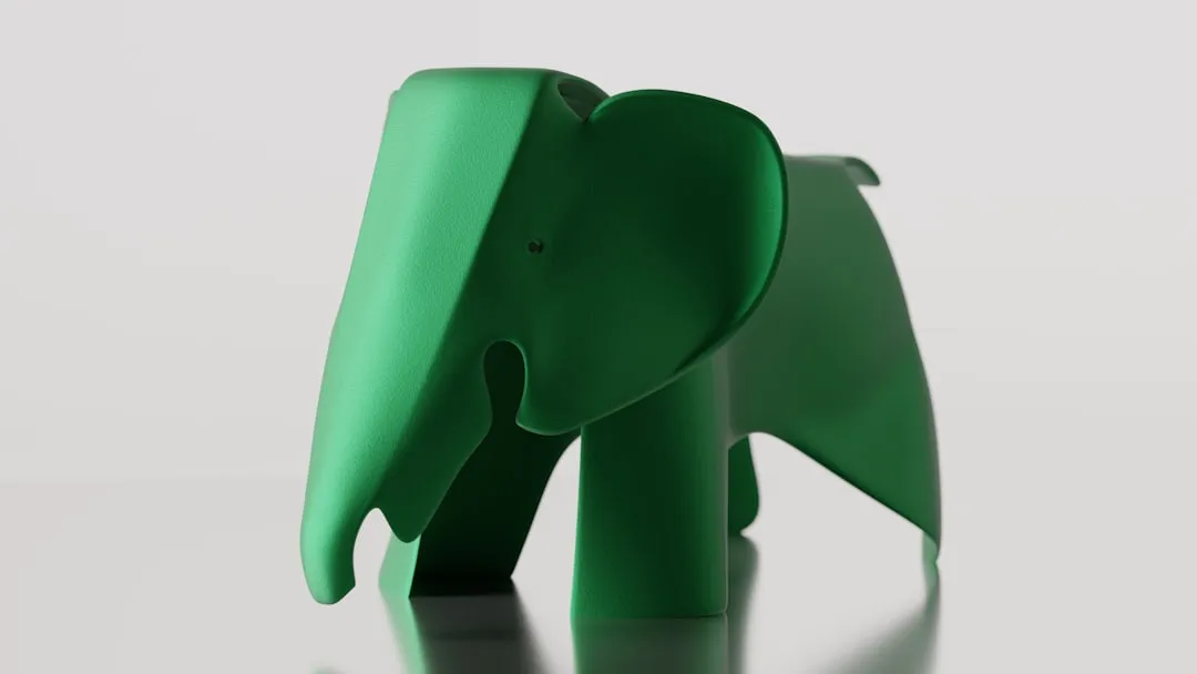 A bright green elephant sculpture stands proudly.