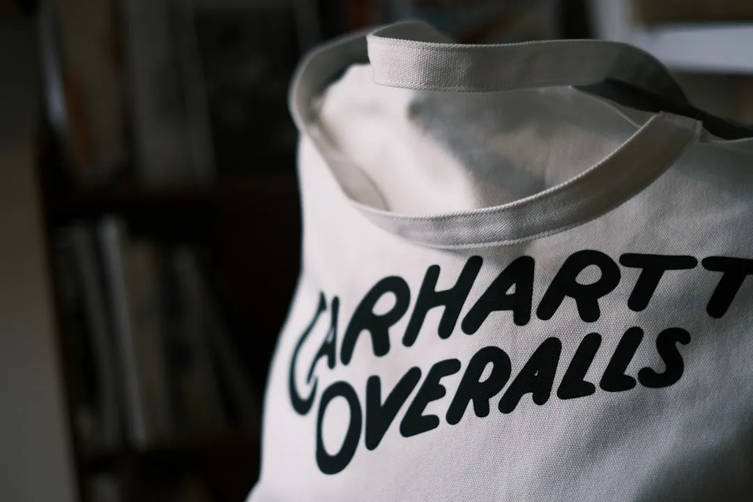 a white tote bag with black lettering on it