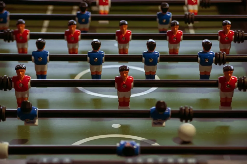 Foosball table with red and blue players.
