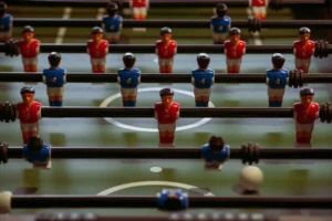 Foosball table with red and blue players.
