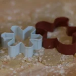 Three cookie cutters on dough
