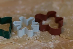 Three cookie cutters on dough