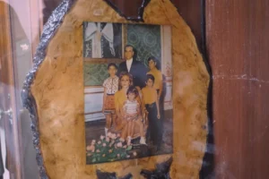 Family portrait in a decorative wooden frame