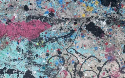 a close up of a wall with paint splattered on it