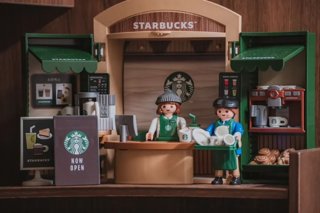 Playmobil figures working at a starbucks counter