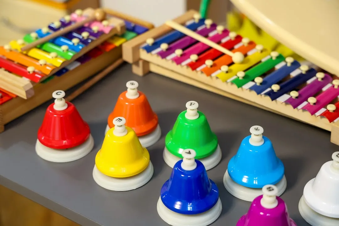 A collection of colorful handbells and xylophones.