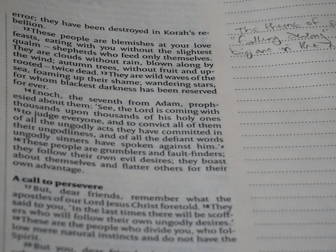 Someone's bible has notes alongside text.