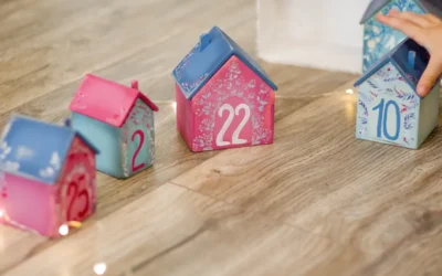 red and white ceramic house on brown wooden table