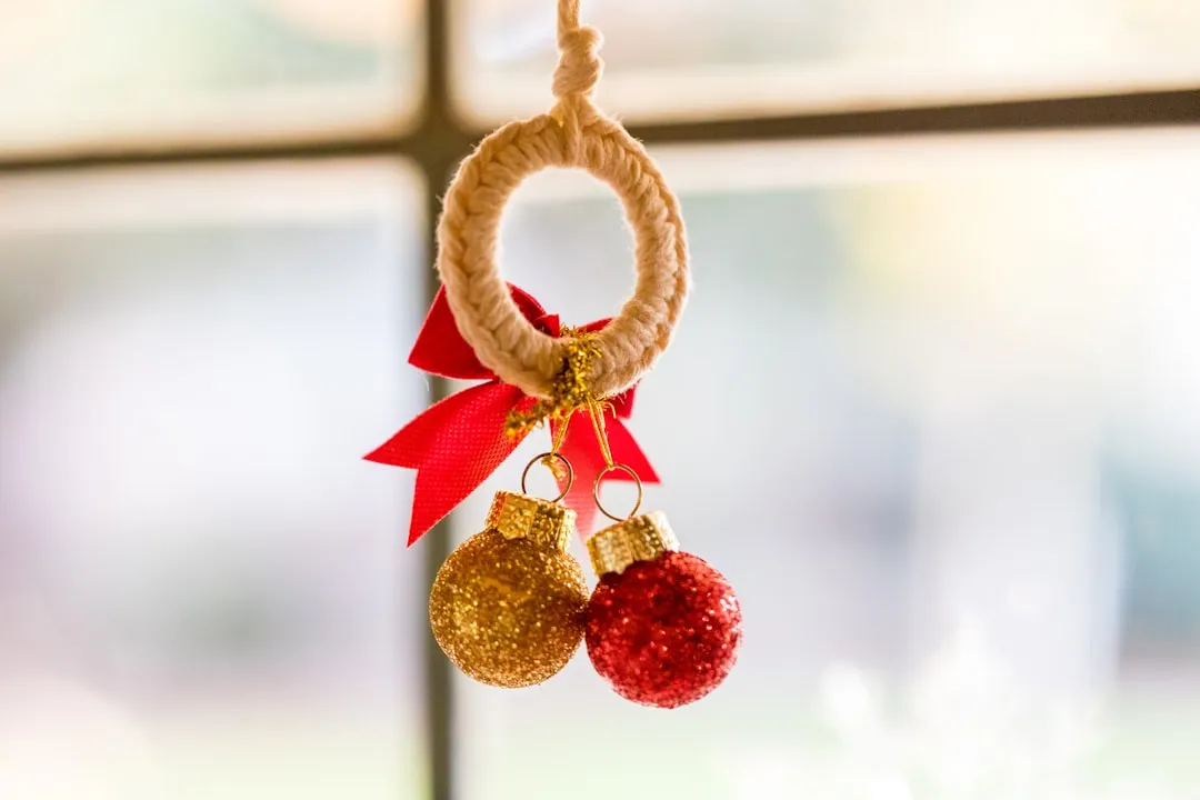 gold and red ball near the window