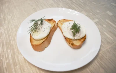 bread with green leaf on white ceramic plate