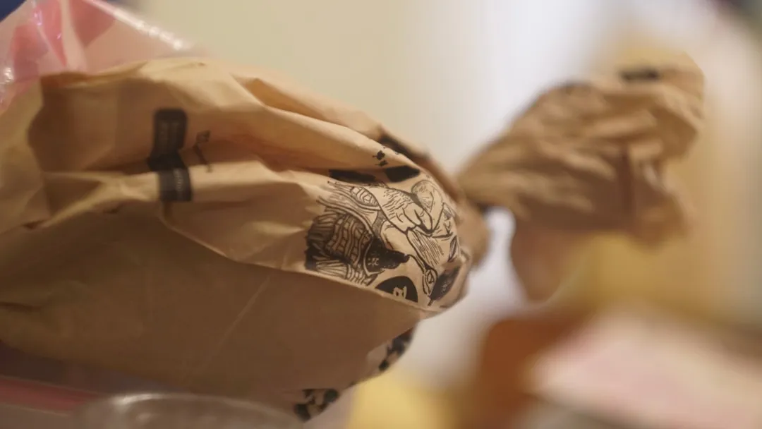 Brown paper bag with black markings on surface